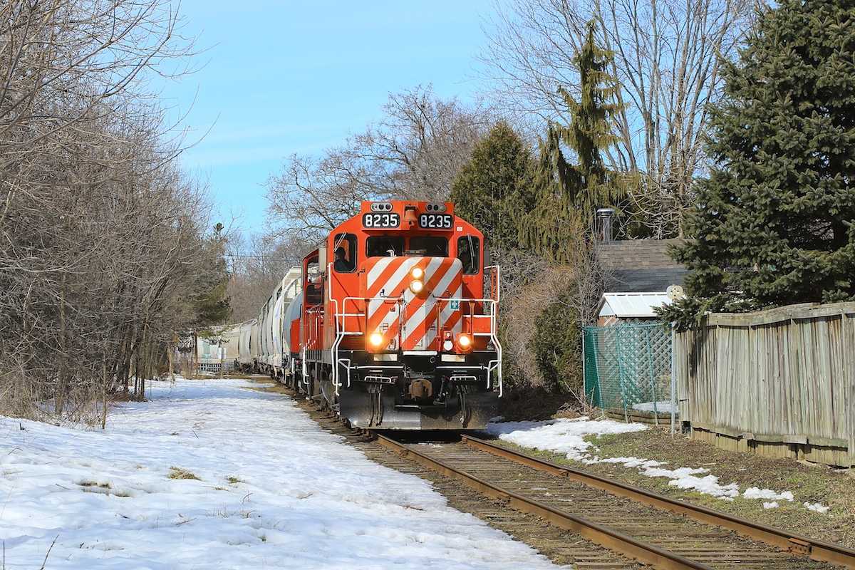 8235 and 1210 lead their train back through Guelph after servicing customers in the northwest of the city.