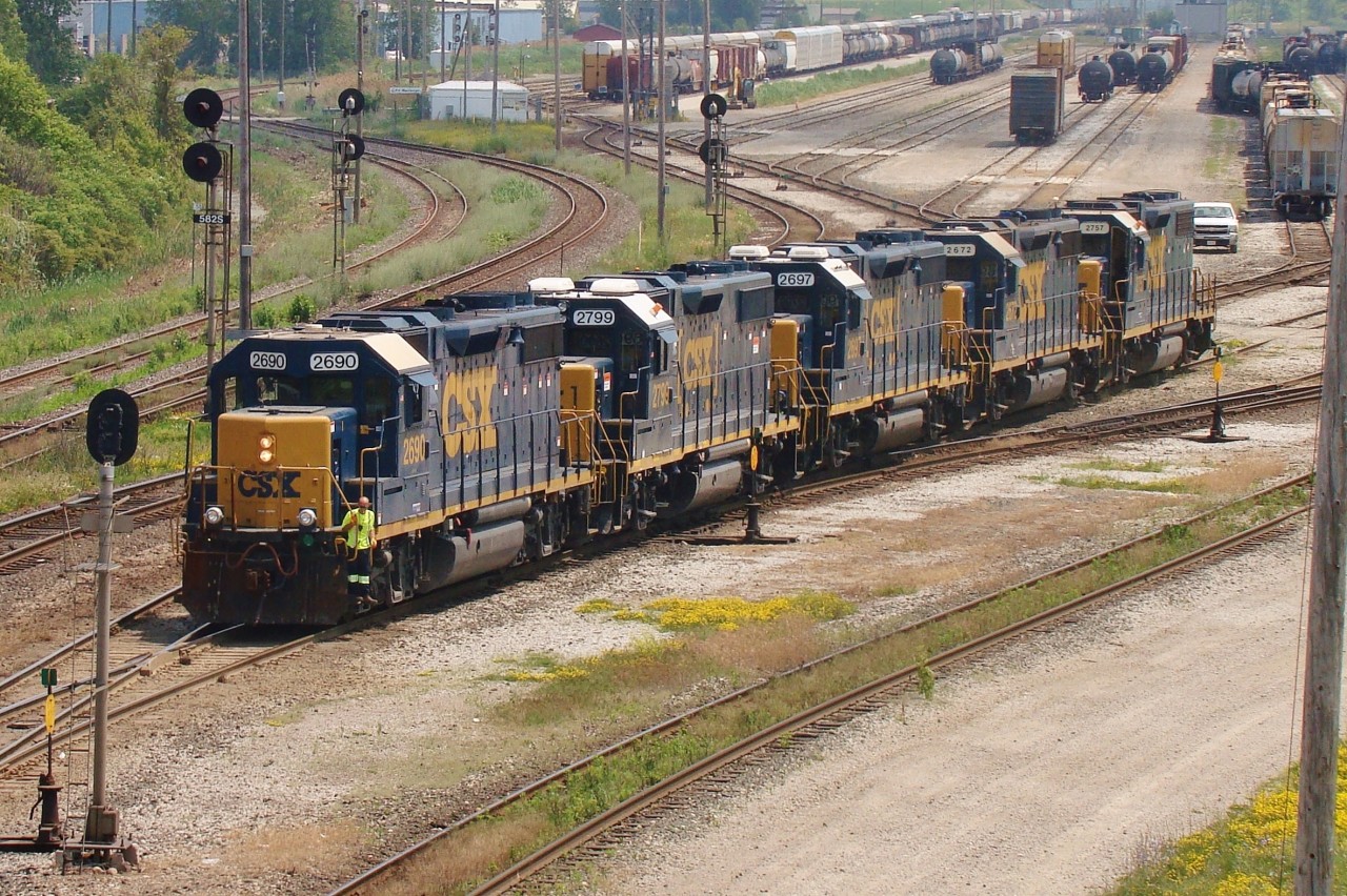 A five pack of CSX GP38-2's prepare to back onto their 80+ car train to take it back to CSX rails on the west side of Sarnia.