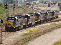 A five pack of CSX GP38-2's prepare to back onto their 80+ car train to take it back to CSX rails on the west side of Sarnia.