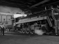 After one of the last CN steam excursions to Fort Erie, CN 6060 returns to the Spadina Roundhouse after being serviced.  Behind her, the old coaling tower looked nice but it hadn't held any coal for many years, 6060 had been converted to oil firing.