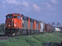 CN 392 didn't always turn up with a trio of MLWs but a trio of near-new SD50Fs (now long gone from the roster) was still a pretty good catch. Here's 5446 and two more approaching Tremaine Road.