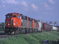 CN 392 didn't always turn up with a trio of MLWs but a trio of near-new SD50Fs (now long gone from the roster) was still a pretty good catch. Here's 5446  and two more approaching Tremaine Road. 