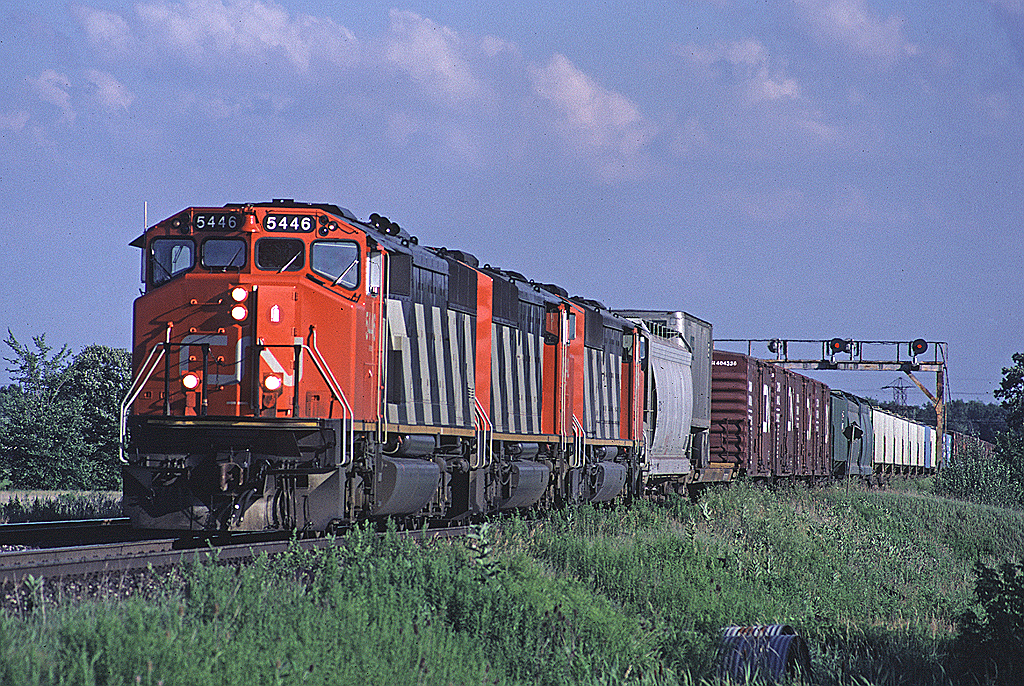 CN 392 didn't always turn up with a trio of MLWs but a trio of near-new SD50Fs (now long gone from the roster) was still a pretty good catch. Here's 5446  and two more approaching Tremaine Road.