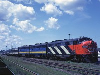 CN FP9A 6519 and a pair of Via-painted F9Bs lead Via #15 "The Ocean" as it sits at Truro making its station stop.