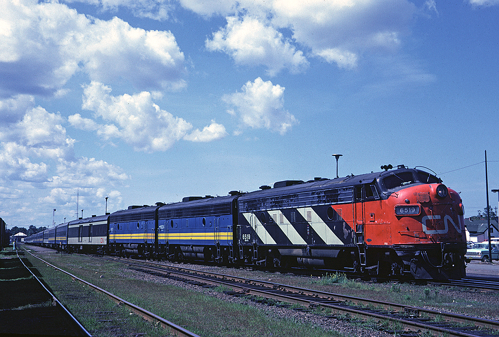 CN FP9A 6519 and a pair of Via-painted F9Bs lead Via #15 "The Ocean" as it sits at Truro making its station stop.