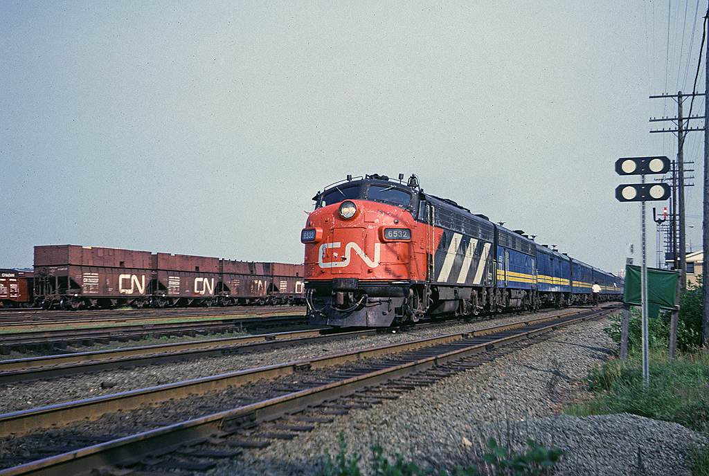 CN FP9A 6532 leads #11, the Scotian, past the station at Rockingham, six miles into its trip from Ocean Terminal in Halifax to Montreal's Central Station.