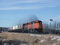 CN 9509 leads a trio of GP40-2Ws with a hotshot eastbound. 