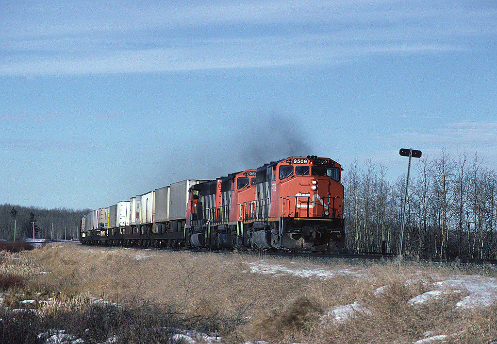CN 9509 leads a trio of GP40-2Ws with a hotshot eastbound.