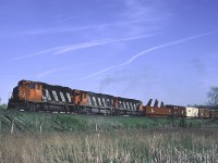 CN GP40-2W 9520 leads a pair of big MLWs on Sarnia - Montreal train #392, just about to cross Mainway. #392 was a regular early evening train through Bayview, its appearance was often my cue to hit the 403 to try for a nose lit shot after the train swung north on to the Halton Sub.