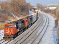CN 401 with CN 5702 and CN 2129 is westbound towards Taschereau Yard where this train will terminate. 