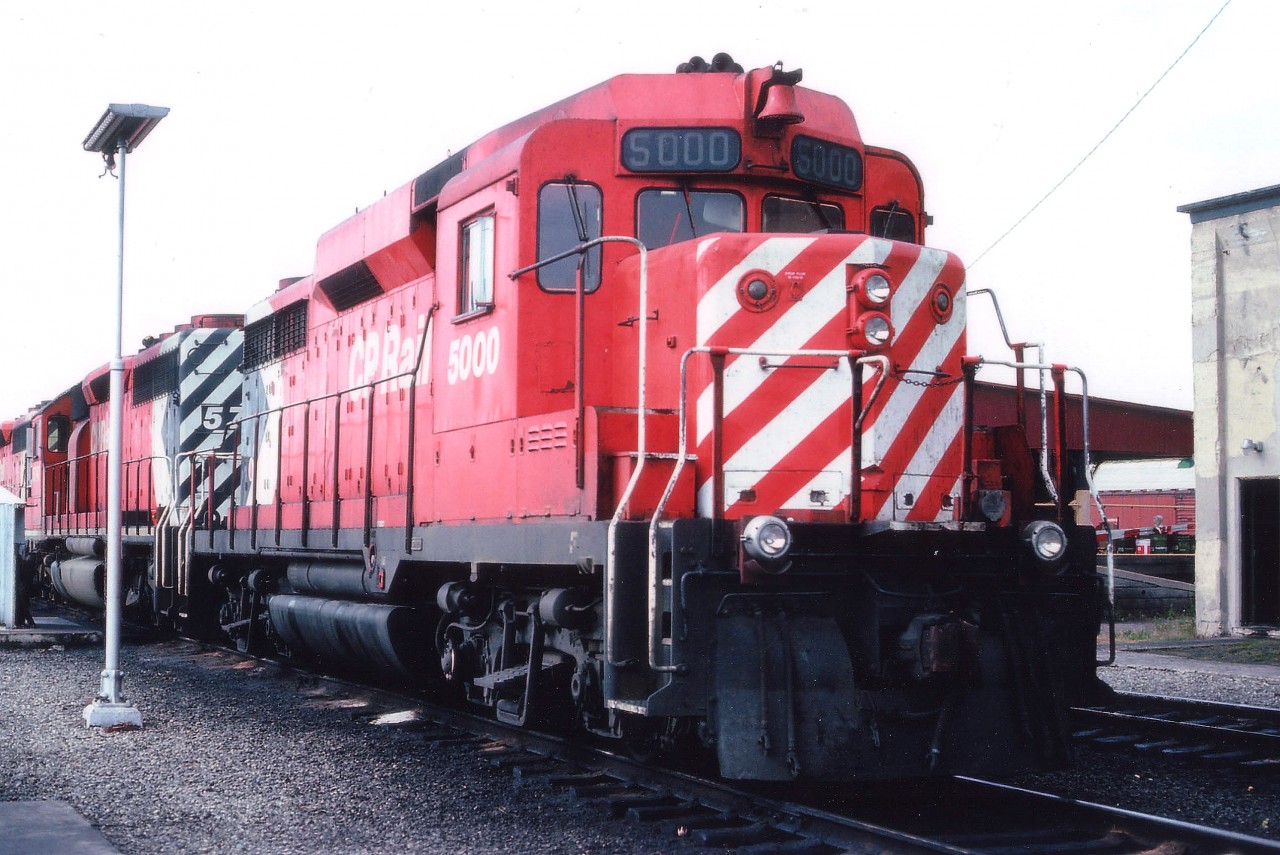 I would any day rather shoot trains on the move than roster shots in a yard. But there are some exceptions. This is one of only two of Canada's GP-30 locomotives, the other being 5001. By the beginning of the 1960s, first generation diesels like the ALCO RS series, the Cab units, small GPs and SWs were becoming tired, and the rebuilding/replacement era was coming up.........Due to the fact that GMD was having a tough time coming up with something distinct to represent "Second Generation" locomotives, professional industrial artists were hired to design  a noteworthy appearing locomotive to usher in Generation #2, and this is what they came up with. Styling, since the demise of the cab unit, had been purely functional. This style commanded attention. By the time CP became interested, the production run had almost ended, and as a result the two units acquired in 1963 became the only ones in this country. The Canadian Trackside Guide states they were around until 1998, but perhaps they had been mothballed for a while? I can't recall seeing them operating since the late 1980s. One or both together could occasionally  be seen on the GALT sub., a favourite hangout. Most interesting loco history!!