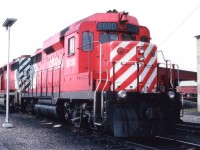 I would any day rather shoot trains on the move than roster shots in a yard. But there are some exceptions. This is one of only two of Canada's GP-30 locomotives, the other being 5001. By the beginning of the 1960s, first generation diesels like the ALCO RS series, the Cab units, small GPs and SWs were becoming tired, and the rebuilding/replacement era was coming up.........Due to the fact that GMD was having a tough time coming up with something distinct to represent "Second Generation" locomotives, professional industrial artists were hired to design  a noteworthy appearing locomotive to usher in Generation #2, and this is what they came up with. Styling, since the demise of the cab unit, had been purely functional. This style commanded attention. By the time CP became interested, the production run had almost ended, and as a result the two units acquired in 1963 became the only ones in this country. The Canadian Trackside Guide states they were around until 1998, but perhaps they had been mothballed for a while? I can't recall seeing them operating since the late 1980s. One or both together could occasionally  be seen on the GALT sub., a favourite hangout. Most interesting loco history!!