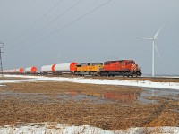 CP 5976 with helper UP 3568 are in charge of eastbound train DIM-003 at mile 88.1 on the CP's Windsor Sub. The towers were constructed in Windsor by CS Wind.