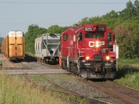 Two CP GP9s are captured working at Ayr. This train was likely the Ham Turn and picked up the three covered hoppers from the Ayr Pit Spur (or about to drop them off there). My memory has failed me on the exact logistics of this work on the evening of June 24, 2009. 