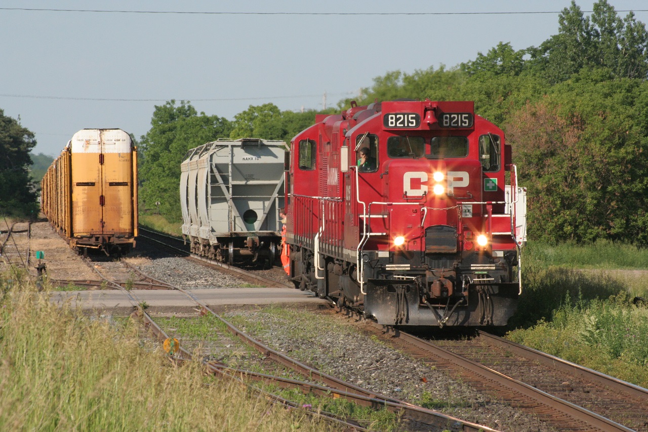 Two CP GP9s are captured working at Ayr. This train was likely the Ham Turn and picked up the three covered hoppers from the Ayr Pit Spur (or about to drop them off there). My memory has failed me on the exact logistics of this work on the evening of June 24, 2009.