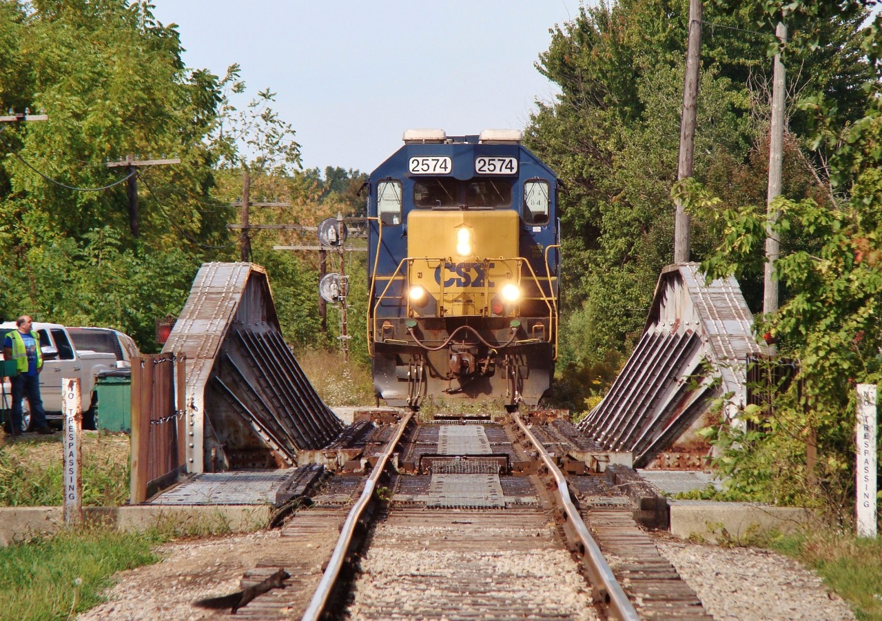 On Sept 25 2013, CSX ran it's last train between Tupperville and Dresden to drop the final car to be loaded at the LAC elevator in Tupperville. The crew stopped for lunch at the dispatchers office just out of frame to the left before crossing the Sydenham River and proceeding onto Dresden to run around their train so they could switch Tupperville. 8 days later and all rail movements on this line south of Sombra would come to an end. 
The municipality of Chatham-Kent took control of the line on October 4 2013, at the same time they sold the infrastructure to CP- who threatened to remove the rails if an operator wasn't found. CK however has recently taken full possession of these rails by buying them back from CP, securing the future of this line for at least a little while. A buyer/ operator is still being pursued to resume railway operations.
