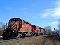 CP 319 is returning from interchange with the CMQ (successor to the MMA) at Iberville with a lengthy train powered by three SD's (CP 5833, CP 6225 & CP 5959) as it passes Lasalle yard.