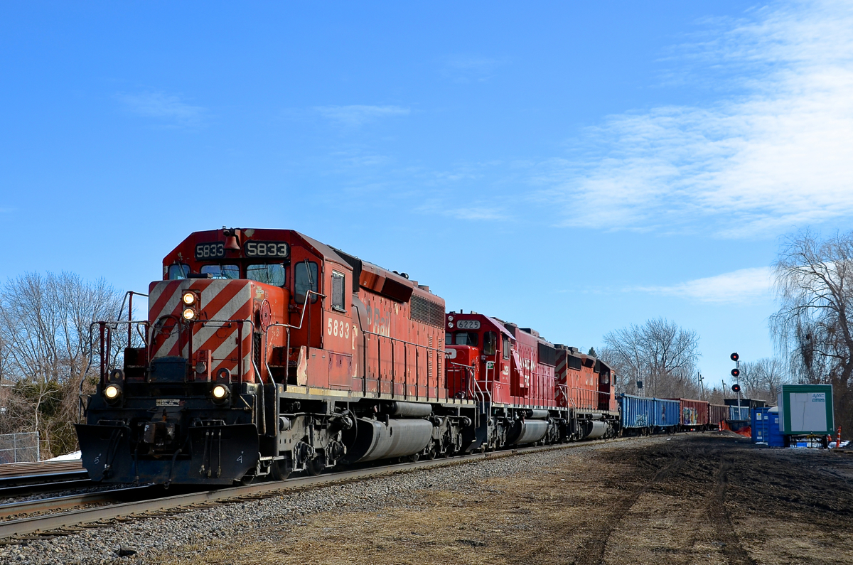 CP 319 is returning from interchange with the CMQ (successor to the MMA) at Iberville with a lengthy train powered by three SD's (CP 5833, CP 6225 & CP 5959) as it passes Lasalle yard.