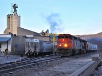 It's early morning in downtown Armstrong as CN 2405 has arrived to lift some cars from the pellet plant.