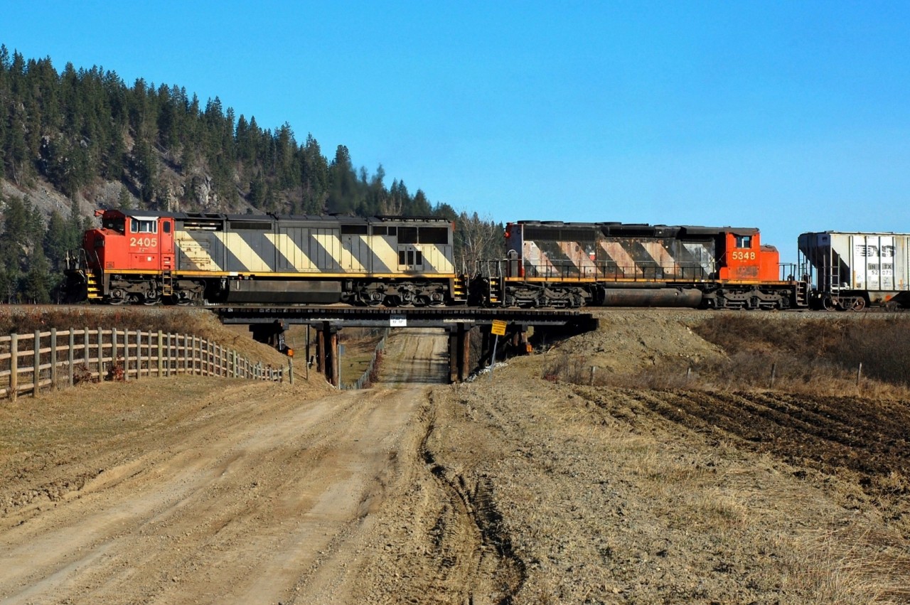 CN nos.2405 & 5348 are climbing out of Armstrong with the morning northbound freight and crossing the recently rebuilt bridge over Betts Rd.