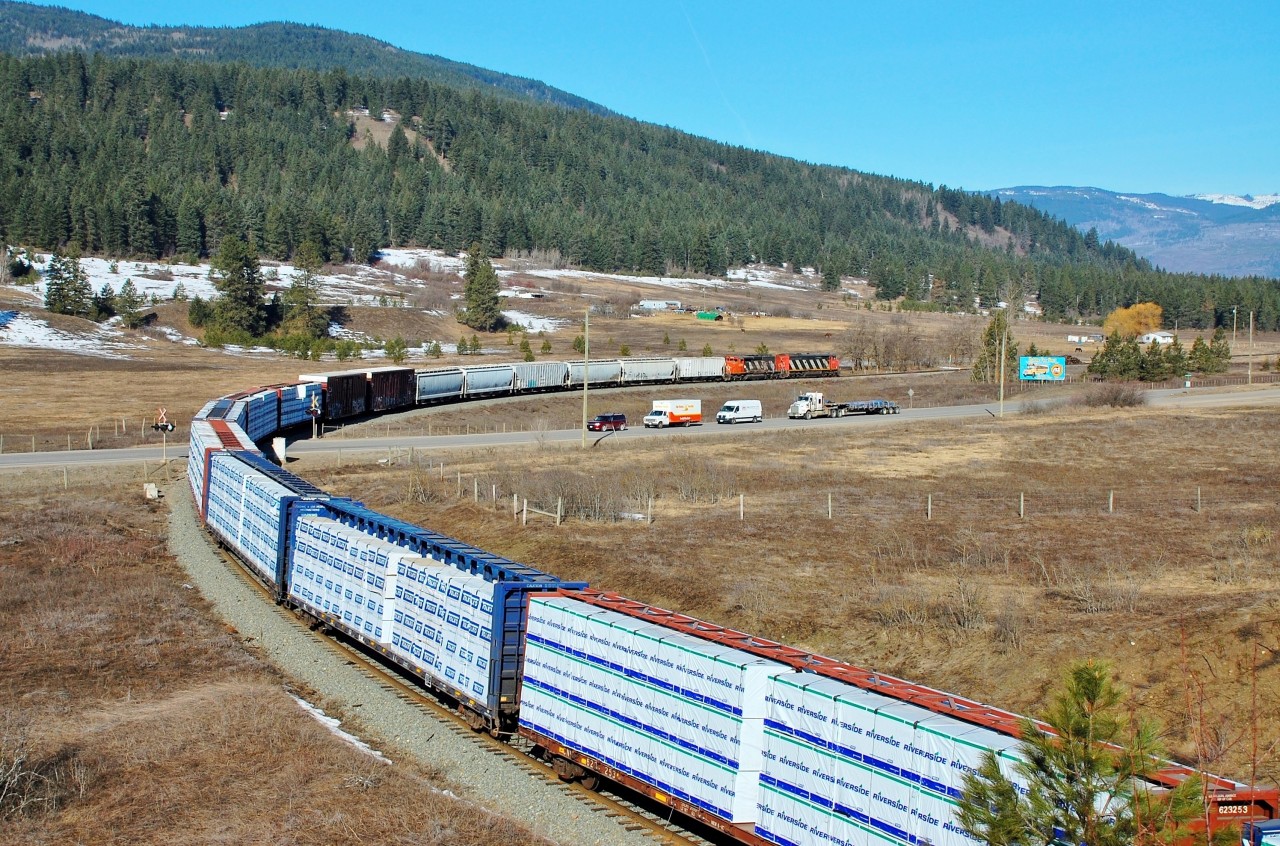 This northbound mixed freight is crossing Hwy97 at O'Keefe in Spallumcheen behind CN nos.2405 & 5348.