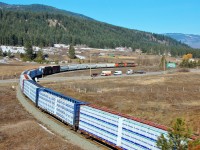 This northbound mixed freight is crossing Hwy97 at O'Keefe in Spallumcheen behind CN nos.2405 & 5348.