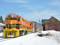 On a sunny but unseasonably cold day the QG Thurso turn passes the Calumet station.  The station dates from the Quebec Montreal Ottawa & Occidental ownership of the line and is one of two remaining station buildings on the Lachute sub.  The other is in the town of Lachute and is restored for use as a community centre/tourist info public building.

KG