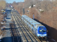 AMT 1352 pushes a deadhead movement west on CP's Westmount sub during the morning rush hour. In the far distance three more AMT trains can be seen near Montreal West station.