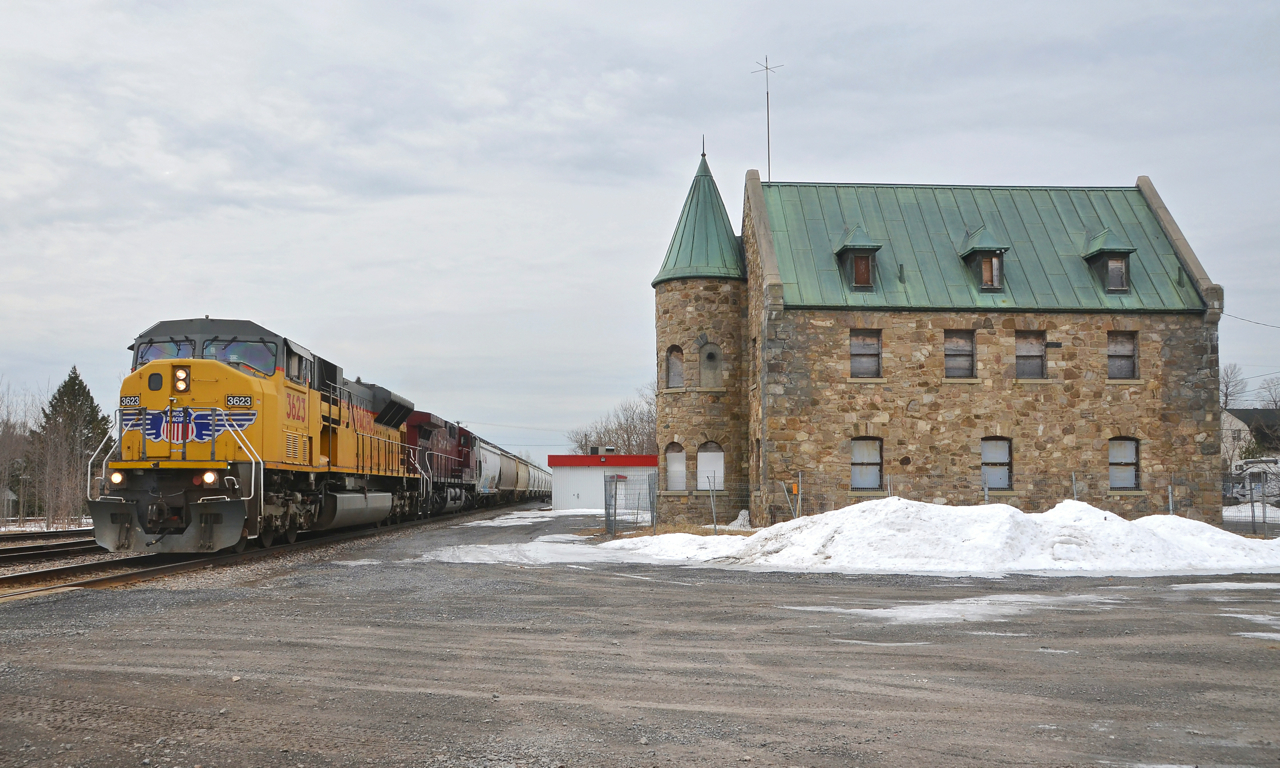 UP 3623 is leading a northbound towards Montreal for the second time in six days as it leads CP 253 (with CP 9595 trailing) past the Lacolle Station which was built by the Napierville Junction railway (a D&H subsidiary) in 1930. This train has come up the old D&H and is 5 miles north of the border at this point. It is heading towards St-Luc yard in Montreal.