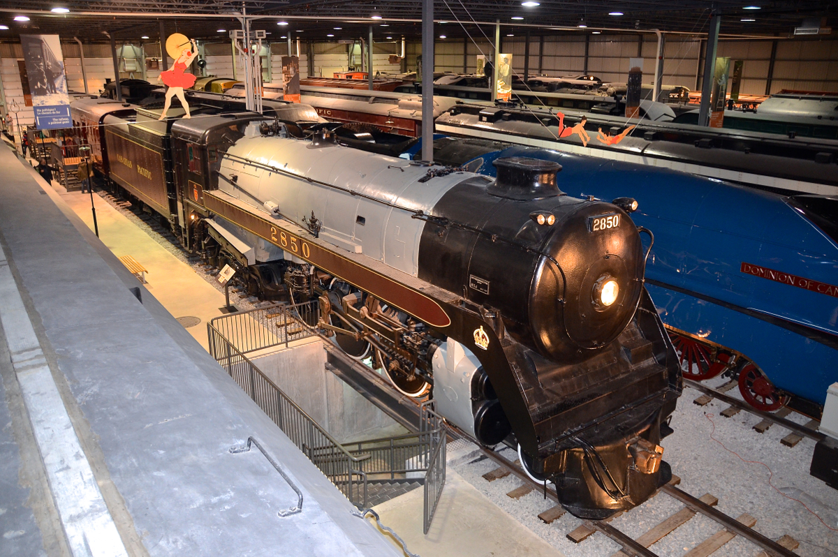 The circus is in town! As part of a circus train exhibit, Exporail has decorated certain pieces with circus illustrations. In the foreground is CP 2850, the original Royal Hudson.