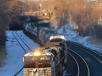 <b>High headlight close to sunset.</b> CN 323 has NS power leading as it heads through Montreal West about 35 minutes before sunset. Full lashup is NS 7623, NS 9242 and CN 5541. This power came into Montreal this morning on CN 528 from Rouses Point, NY and then headed to Saint Albans, VT on CN 324. 