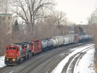 CN 394 for Richmond, Qc and interchange with the St. Lawrence and Atlantic has CN 2102 and CN 2689 as it heads east through the Ville St-Pierre neighbourhood of Montreal. 