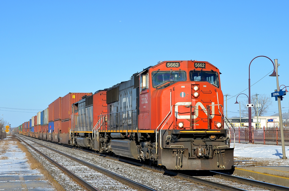 CN 5662 & CN 5519 lead a late CN 120 through Dorval after having gone into emergency just west of the island of Montreal.