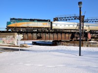 <b>Approaching the Wellington Tower.</b> VIA 6401 is about to pass Wellington Tower as it leads a slightly late VIA 64 from Toronto over the Lachine Canal.