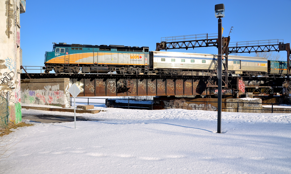 Approaching the Wellington Tower. VIA 6401 is about to pass Wellington Tower as it leads a slightly late VIA 64 from Toronto over the Lachine Canal.