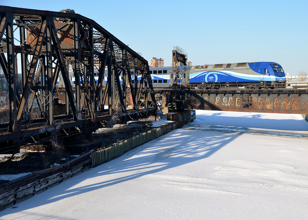 AMT 1350 pushes a deadhead movement towards Montreal's Central Station during the evening rush hour.