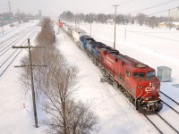 <b>Last stand for piggyback in Canada.</b> CP 132 and its counterpart CP 133 are the only dedicated 100% piggyback trains remaining in Canada. They run daily from Montreal to Toronto and vice-versa and CP 132 generally enters Montreal before sunrise (westbound CP 133 usually leaves Montreal about 1930 and so is only shootable a few months a year). However delays can lead to late trains of course, and this morning I shot CP 132 at about 0915 in Ste-Anne-de-Bellevue, a suburb at the very western tip of the island of Montreal with CP 8873 and CEFX 1035 as power.