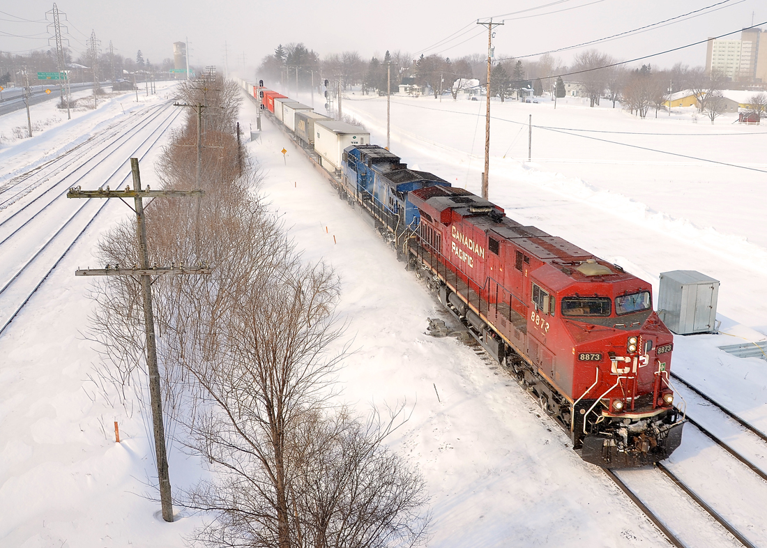 Last stand for piggyback in Canada. CP 132 and its counterpart CP 133 are the only dedicated 100% piggyback trains remaining in Canada. They run daily from Montreal to Toronto and vice-versa and CP 132 generally enters Montreal before sunrise (westbound CP 133 usually leaves Montreal about 1930 and so is only shootable a few months a year). However delays can lead to late trains of course, and this morning I shot CP 132 at about 0915 in Ste-Anne-de-Bellevue, a suburb at the very western tip of the island of Montreal with CP 8873 and CEFX 1035 as power.