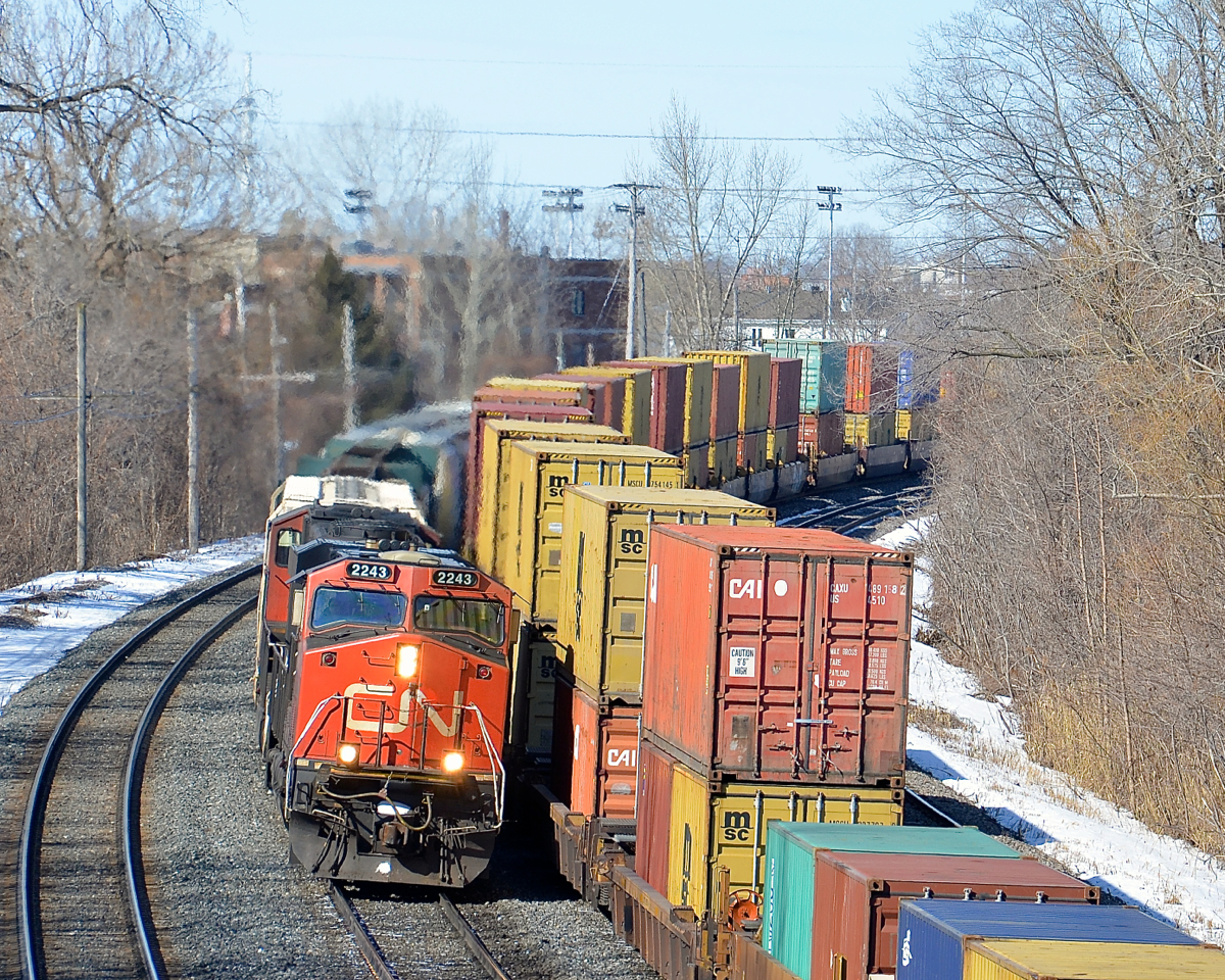 CN X372 with CN 2249 in the lead passed CN 149 at right.