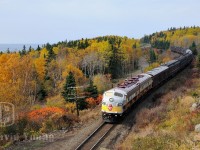 <B>A Special Charter:</b> Skirting the shores of Lake Superior (seen in the background) and through the gorgeous fall colours northwestern Ontario has to offer, CP's business train heads east for Toronto with a group of Canadian Tire owners taking a cross country tour. The tour which started in Calgary, has been a long drawn out affair. I remember talking to the "owners" during the crew change in White River and they were disappointed they were not allowed to get off the train and explore some of the areas where the train stopped, for liability reasons. A sign of current times I guess...