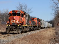 CN 4725 crosses Degurse Dr. with a cut of cars on the Industrial Sub south of Sarnia.