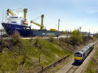 The last pair of a Nedrail (Netherlands) order for ten JT42CWR (EMD Class 66) locomotives are test run on the Trillium Railway in May 2006. ITS Rail assembled the locomotives under subcontract to EMD, at the ITS Rail plant in St. Catharines, ON.  As the locomotives are run south up the escarpment the Jumboship Daniella approaches lock 7 on the Welland Canal on its way to Toronto Harbour where the locomotives will be loaded for their trip to Europe.