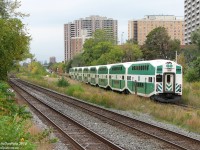 GO Transit cab car 232 trails "The Bramalea Flip", the weekday afternoon Brampton to Toronto (Bramalea Station to Union Station) GO train, passing through the community of Weston, in Toronto Ontario. The train with F59PH 522 in the lead is approaching Weston Station for its stop around ~10:30am, with downtown a mere 15 minutes away.
<br><br>
A lot has changed in this scene: the old station (including a waiting room dating from the old CNR days) has been demolished and moved south along the line. Extra tracks have been added, and the entire ex-CN Weston Sub corridor here has become a big trench or flyunder, due to the vocal protesting of some Weston community groups that adding more frequent GO service and the Union-Pearson Express trains would divide their community (ironically enough, the busy freight-only CP MacTier Sub on the left still crosses through Weston at-grade!). Much of the greenery and foliage has been removed by Metrolinx during the construction.
<br><br>
But trains still roll through Weston, the town that grew up around the railway lines and industries they served ever since the Grand Trunk Railway laid rails through the pre-village settlement here in 1856, 159 years ago.