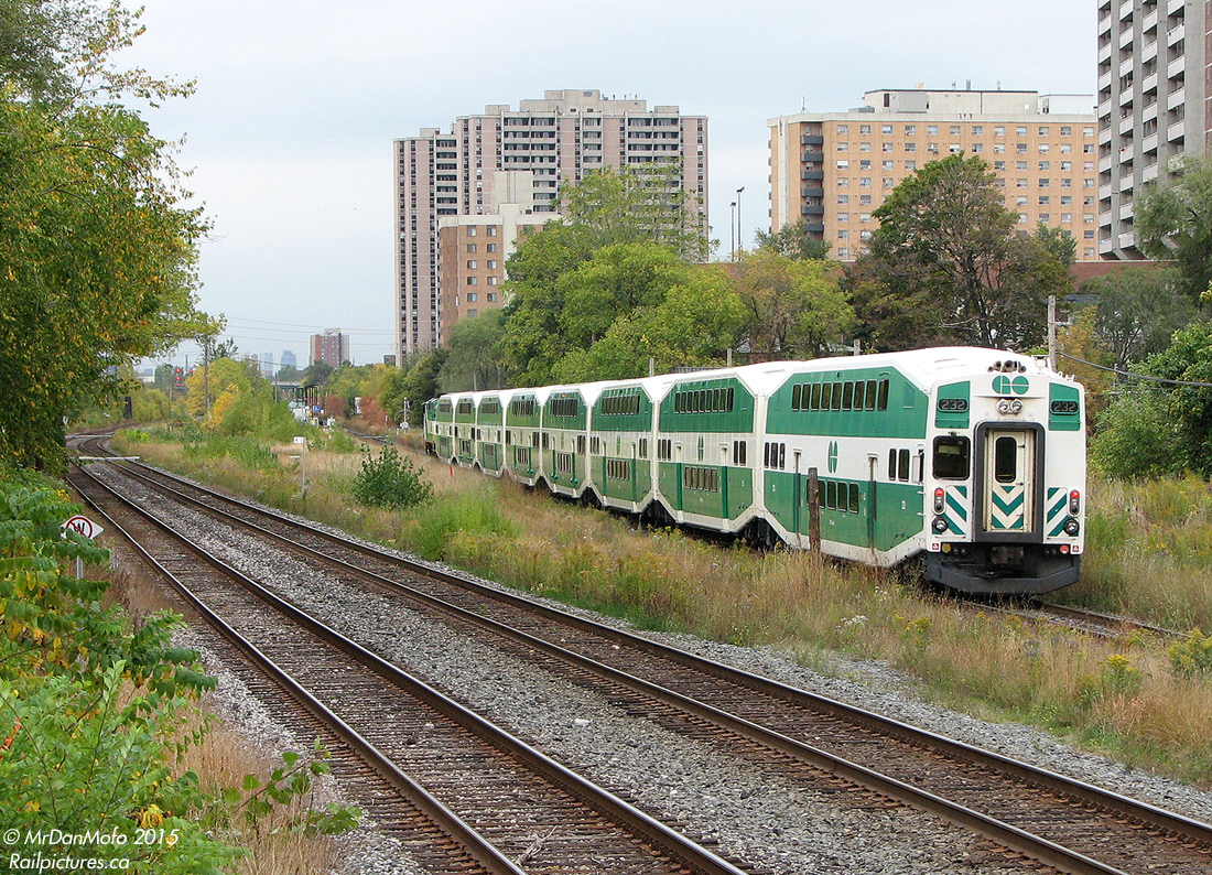GO Transit cab car 232 trails "The Bramalea Flip", the weekday afternoon Brampton to Toronto (Bramalea Station to Union Station) GO train, passing through the community of Weston, in Toronto Ontario. The train with F59PH 522 in the lead is approaching Weston Station for its stop around ~10:30am, with downtown a mere 15 minutes away.

A lot has changed in this scene: the old station (including a waiting room dating from the old CNR days) has been demolished and moved south along the line. Extra tracks have been added, and the entire ex-CN Weston Sub corridor here has become a big trench or flyunder, due to the vocal protesting of some Weston community groups that adding more frequent GO service and the Union-Pearson Express trains would divide their community (ironically enough, the busy freight-only CP MacTier Sub on the left still crosses through Weston at-grade!). Much of the greenery and foliage has been removed by Metrolinx during the construction.

But trains still roll through Weston, the town that grew up around the railway lines and industries they served ever since the Grand Trunk Railway laid rails through the pre-village settlement here in 1856, 159 years ago.