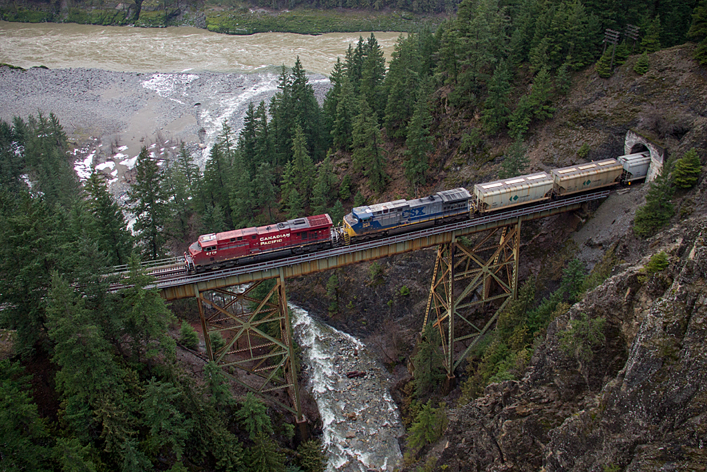 CP potash loads head westbound, crossing the Ainslie Creek trestle, 15 miles east of Boston Bar. Behind the lead unit is a foreign visitor, CSXT AC4400CW 303, far from home. For the past year a variety of foreign power has been showing up on CP, including UP, CSX, BNSF, NS and even KCS.