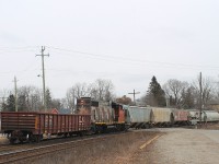 CN Distributed power or just weird? CN 4774 arrives with a gondola at the front and hoppers to the rear. I don't know where they were going to leave them, as the North service track was completely full with tank cars?