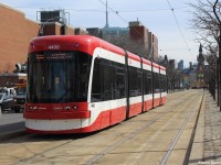 Class leading TTC 4400, one of the newly acquired streetcars, runs on Spadina Ave by the campus of the University of Toronto. Now, time to photograph some of the older streetcar models before they go 'extinct' at the snap of a finger. 