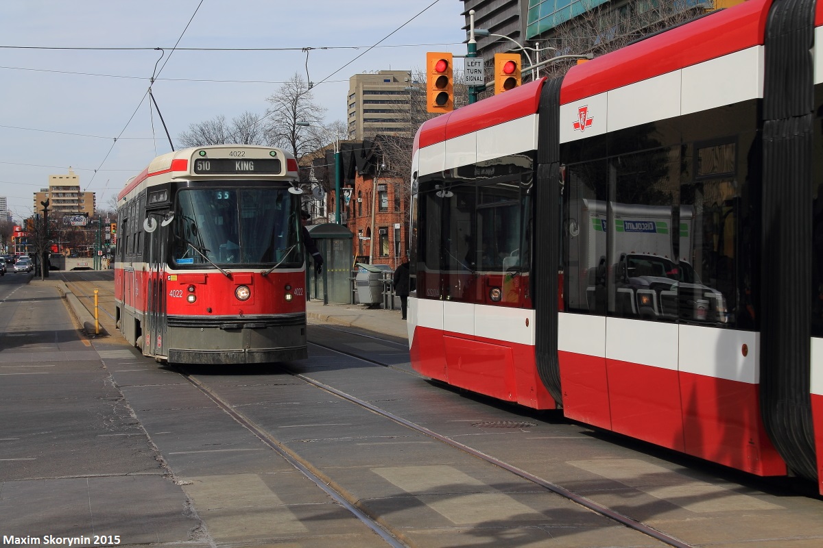Old meets new, one of the newly acquired Flexity Outlook streetcars is operating on the 510 Spadina Route - the only route that meets the sufficient needs of these streetcars. By 2019, all 11 of Toronto Transit Commission's streetcar routes will have these new streetcars in operation.