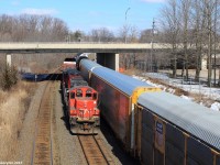 CN GP9RM 4116 is on point of this days 551 which moves cars from Aldershot Yard in Aldershot to Hamilton Yard in Hamilton daily. It is seen here passing by a pedestrian bridge leading to Royal Botanical Gardens on the approach to CN Bayview Junction between the Oakville, Grimsby and Dundas Subdivisions. 
