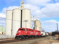 CP's 'Streetsville Turn' just finished switching the 'new' ADM plant across the tracks, and has backed up to Erindale on the main to cross over to the north track, and has just arrived to the 'old' ADM to lift the grainers sitting there.